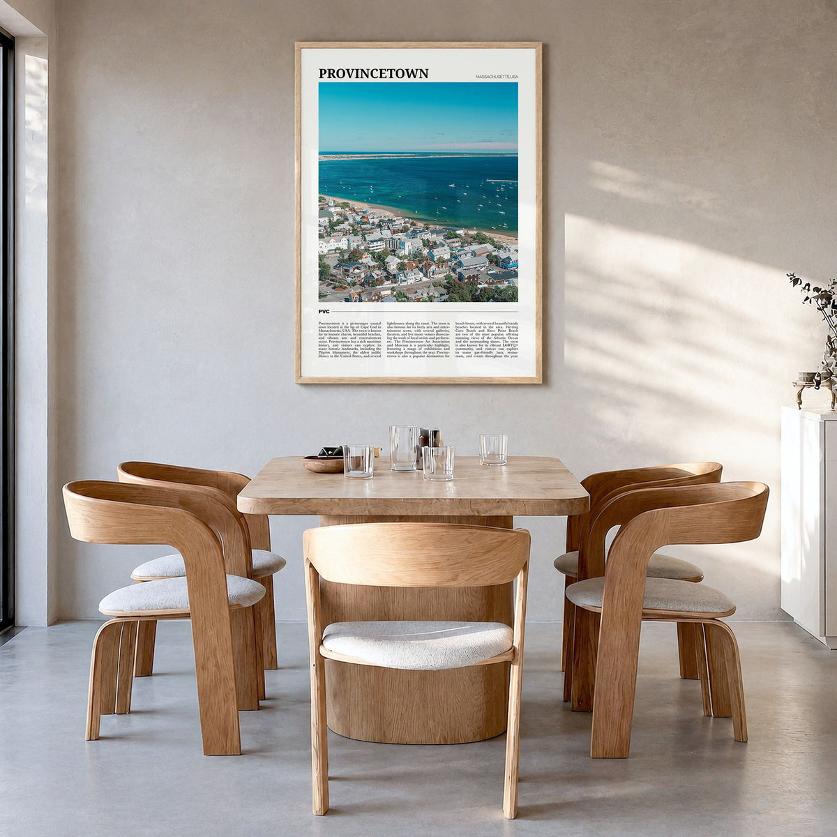 Provincetown Travel Poster in a natural wood frame, hanging in a dining room