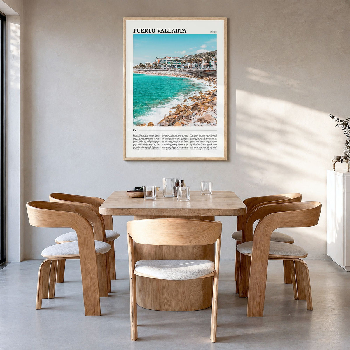 Puerto Vallarta Travel Poster in a natural wood frame, hanging in a dining room