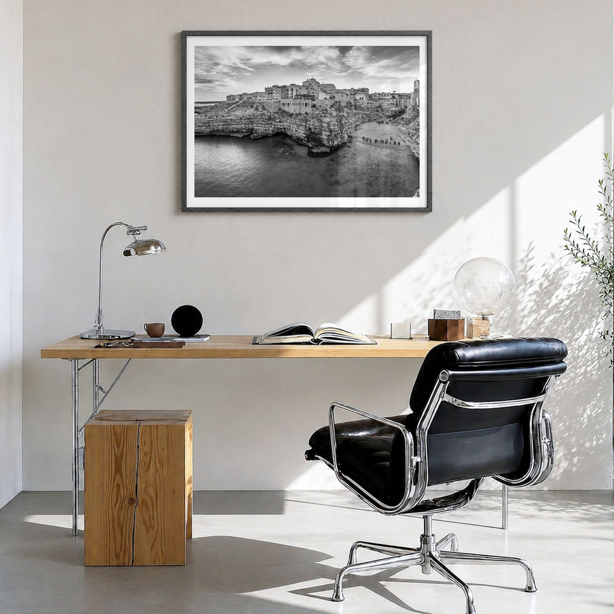 Apulia Photo Poster in a black wood frame, hanging in a bright home office, white border