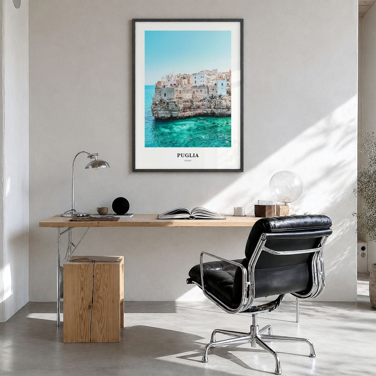 Puglia Classic Poster in a black wood frame, hanging in a bright home office