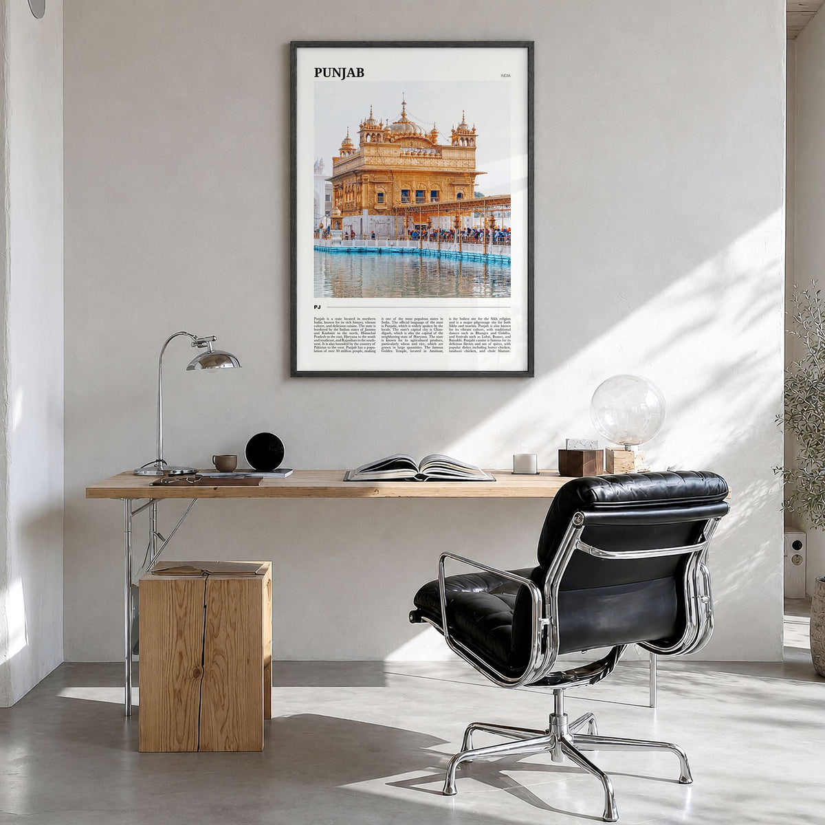 Punjab Travel Poster in a black wood frame, hanging in a bright home office