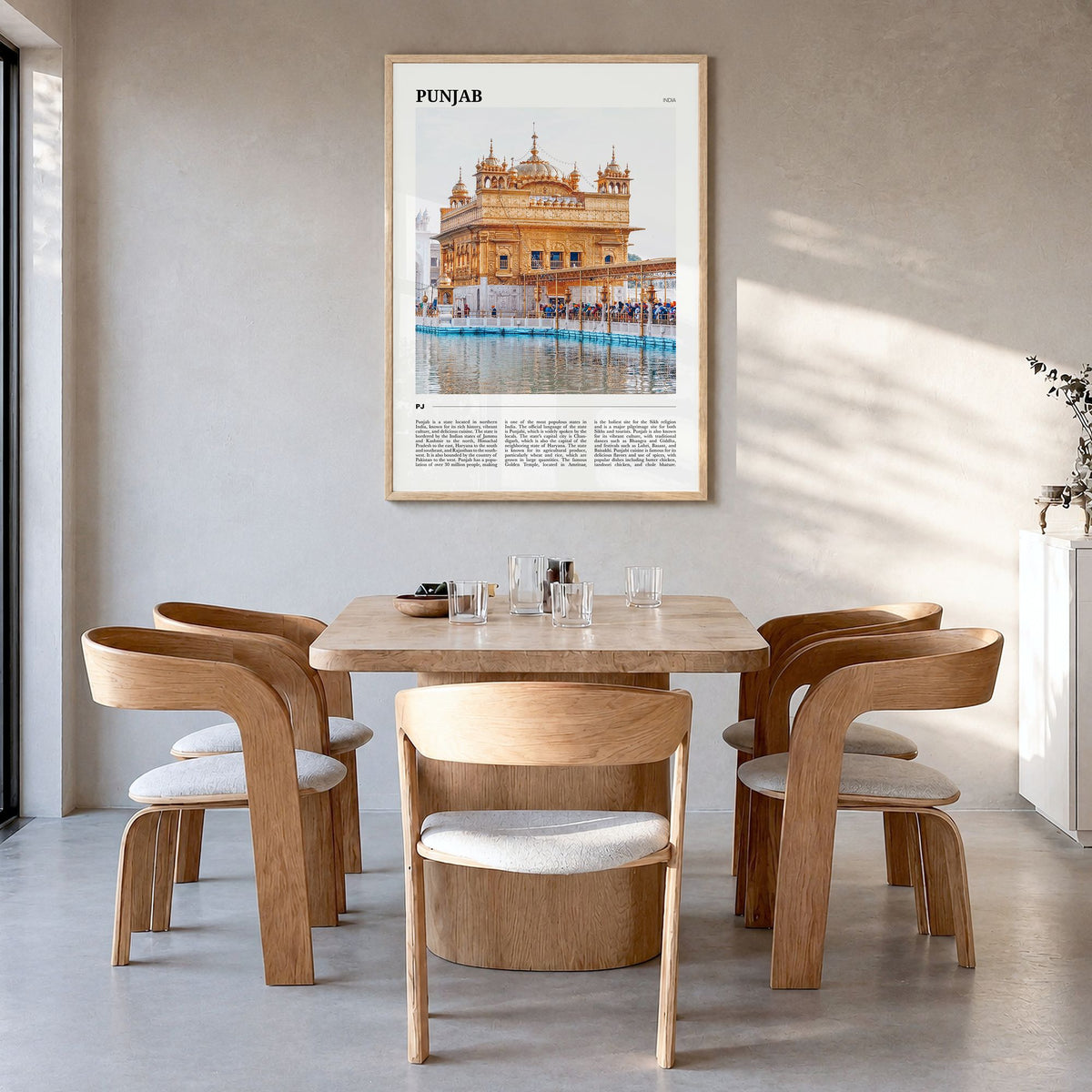Punjab Travel Poster in a natural wood frame, hanging in a dining room
