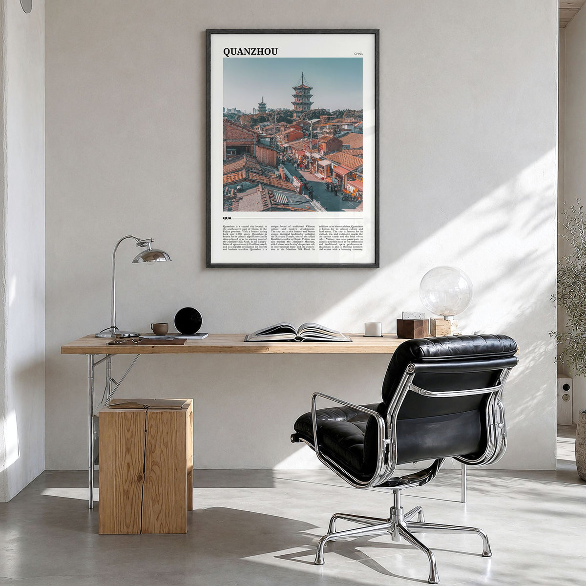 Quanzhou Travel Poster in a black wood frame, hanging in a bright home office