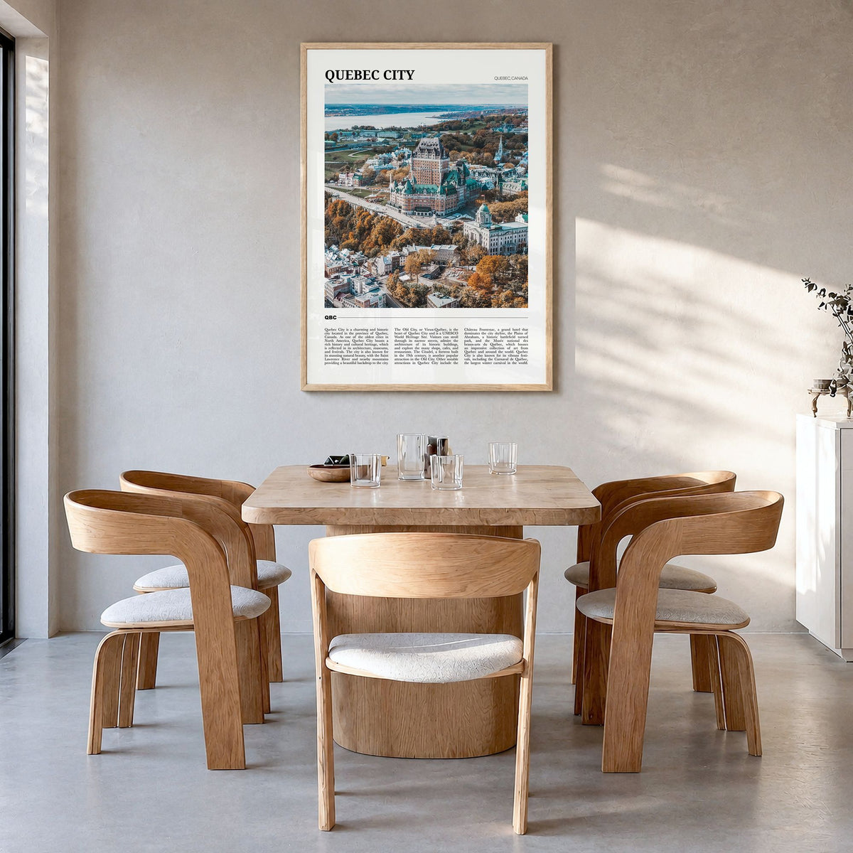 Quebec City Travel Poster in a natural wood frame, hanging in a dining room