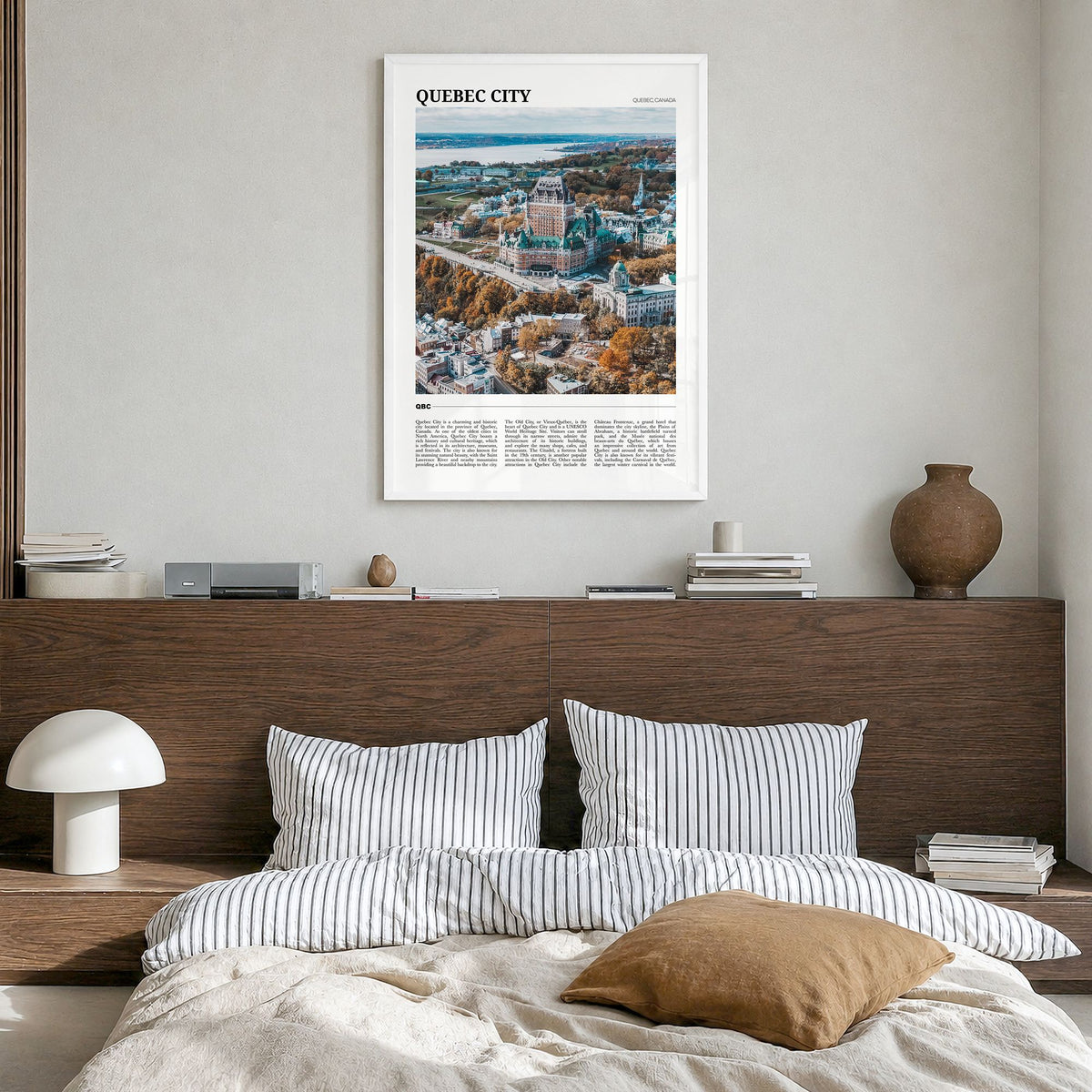 Quebec City Travel Poster in a white wood frame, hanging in a bedroom