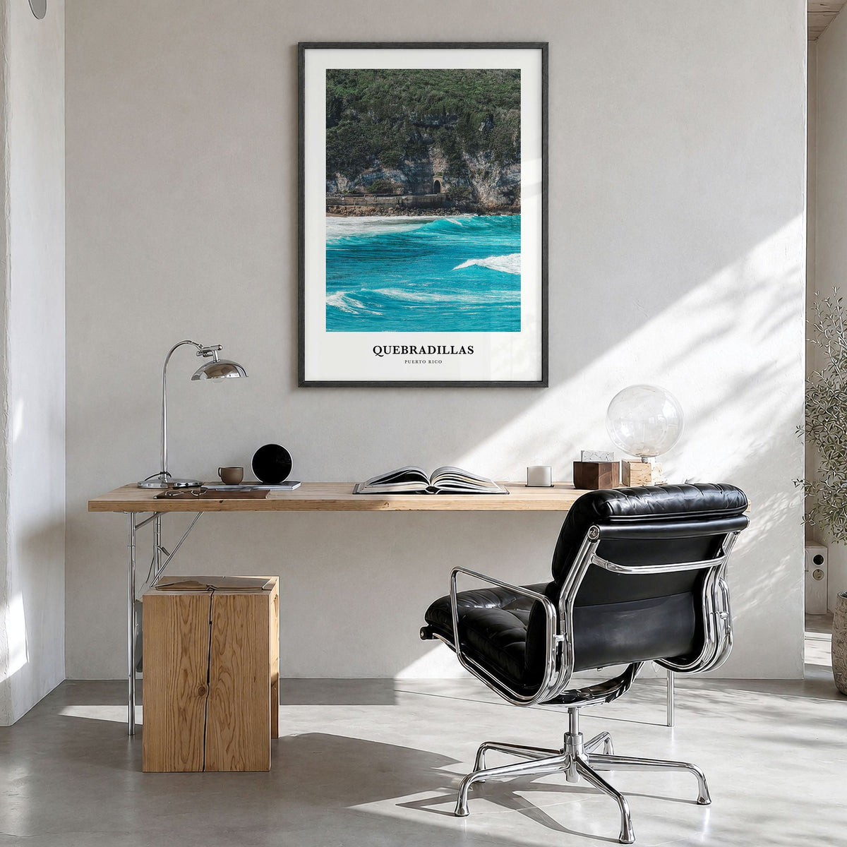 Quebradillas Classic Poster in a black wood frame, hanging in a bright home office