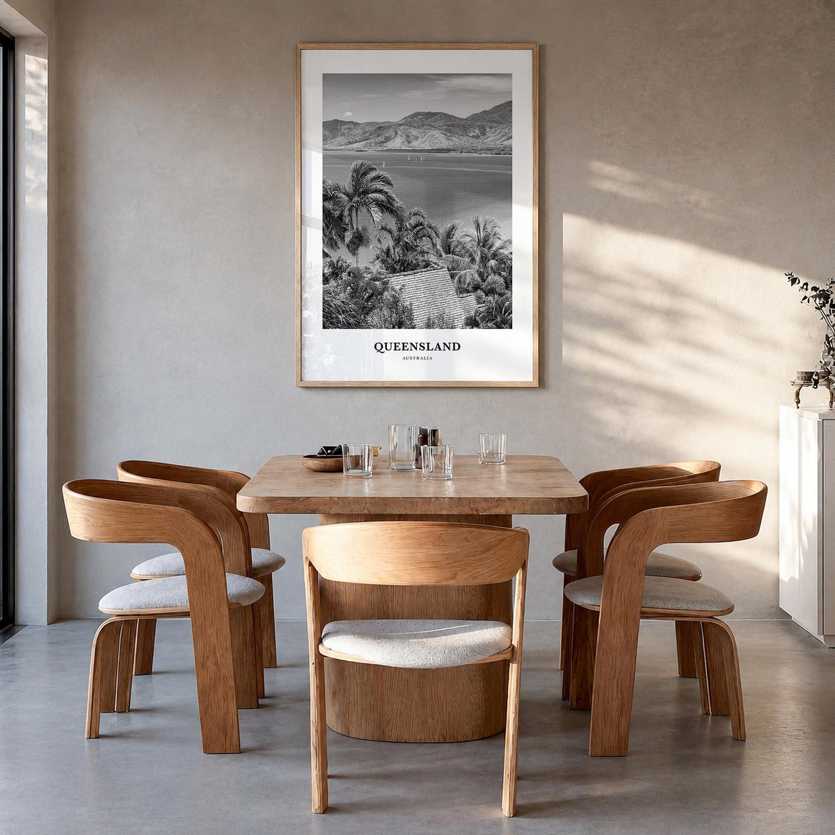 Queensland black & white classic poster of Australia – vertical wall art in natural wood frame, hanging on wall