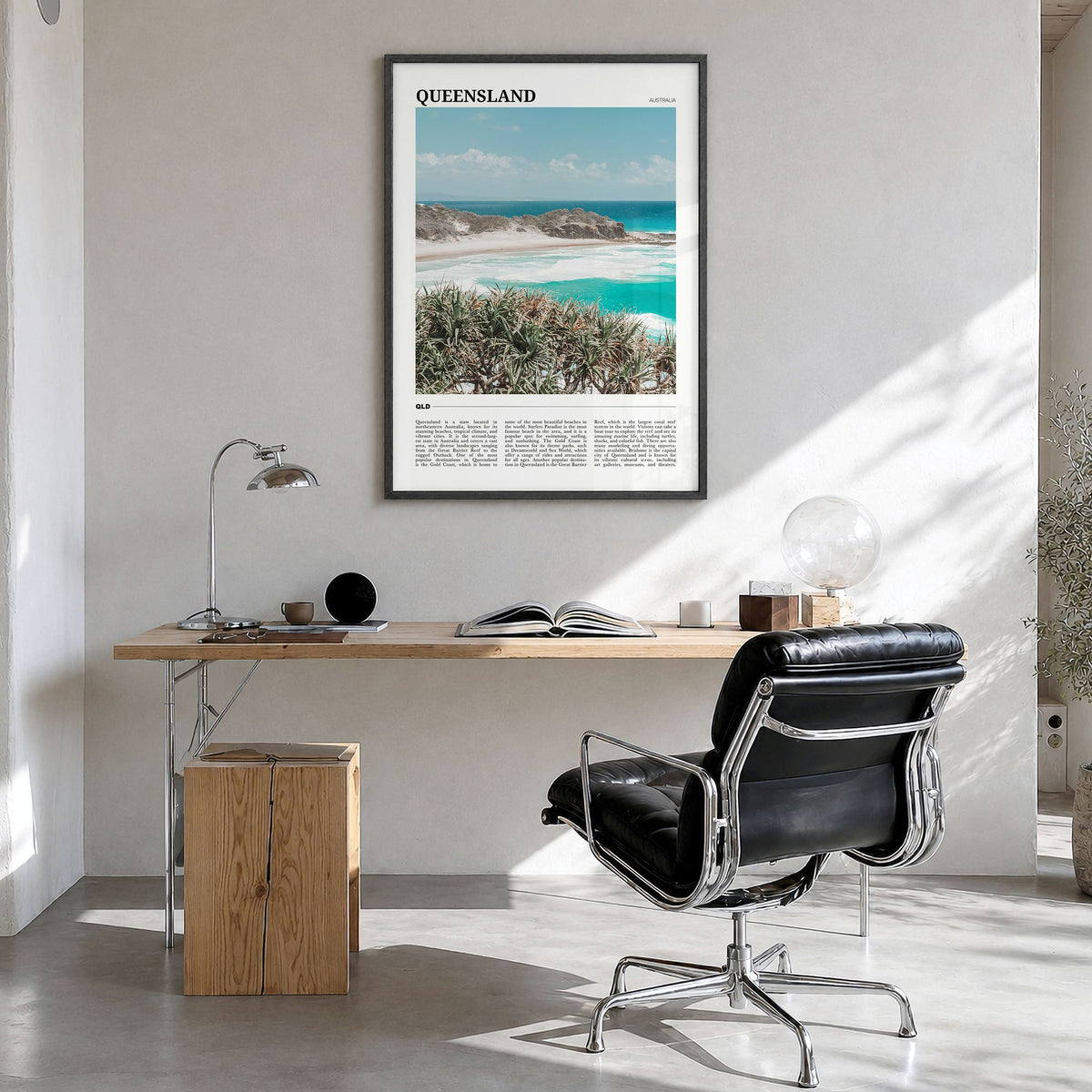 Queensland Travel Poster in a black wood frame, hanging in a bright home office