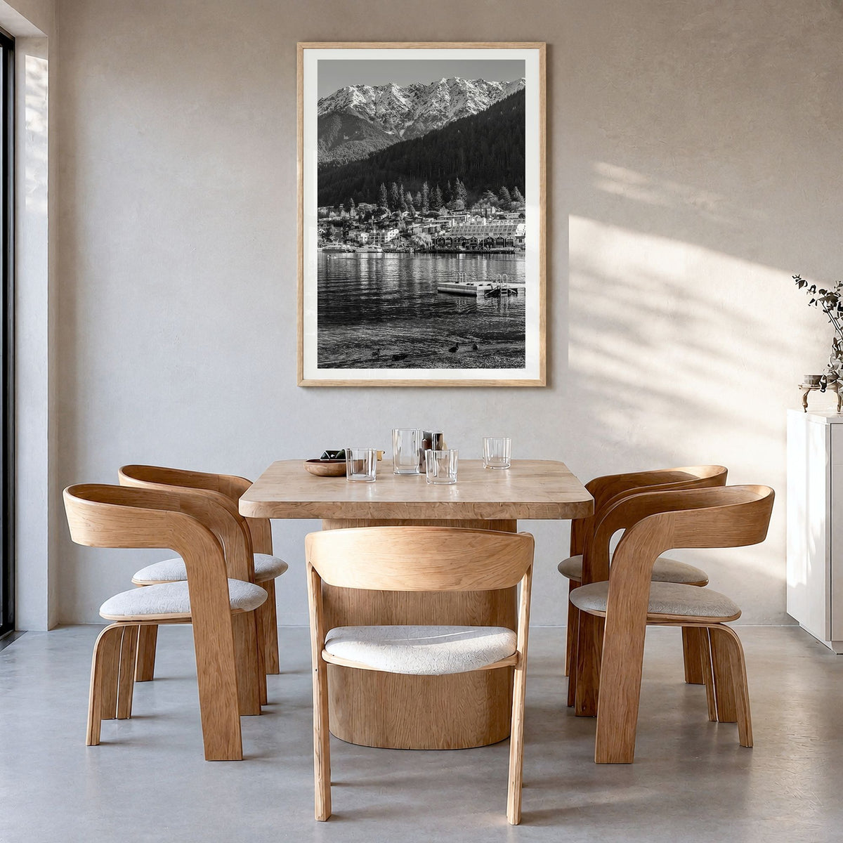 Queenstown Photo Poster in a natural wood frame, hanging in a dining room, white border
