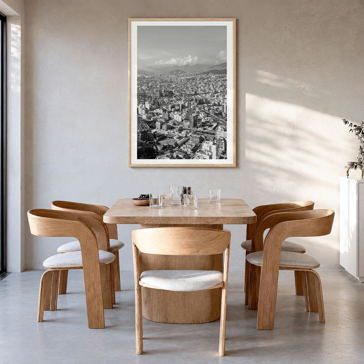 Quito Photo Poster in a natural wood frame, hanging in a dining room, white border