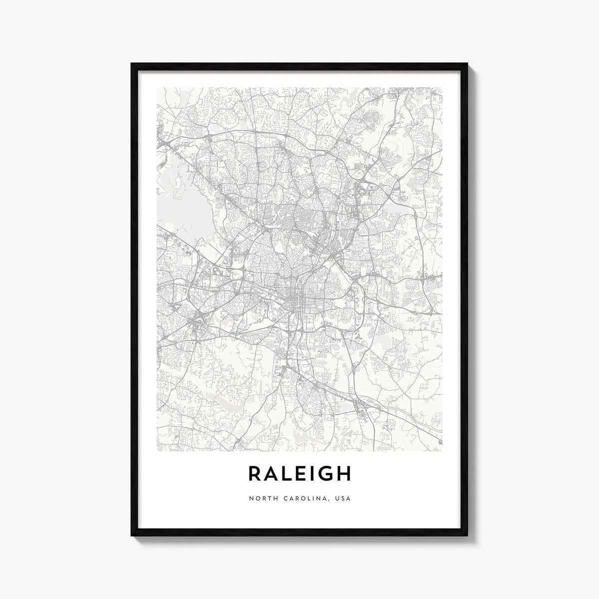 Raleigh black & white map poster of North Carolina, USA – vertical wall art, unframed print shown in interior mockup