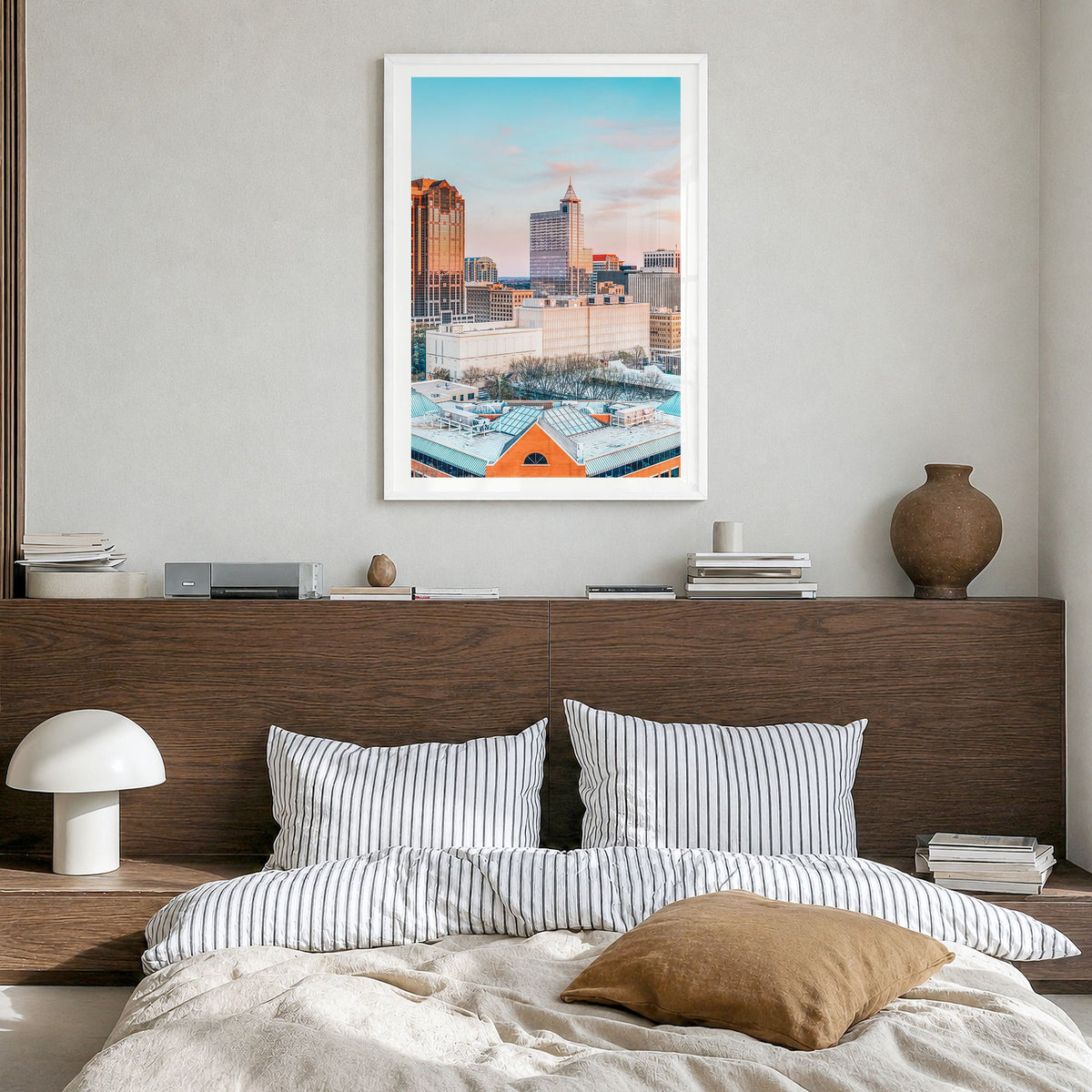 Raleigh Photo No 1 Poster in a white wood frame, hanging in a bedroom, white border