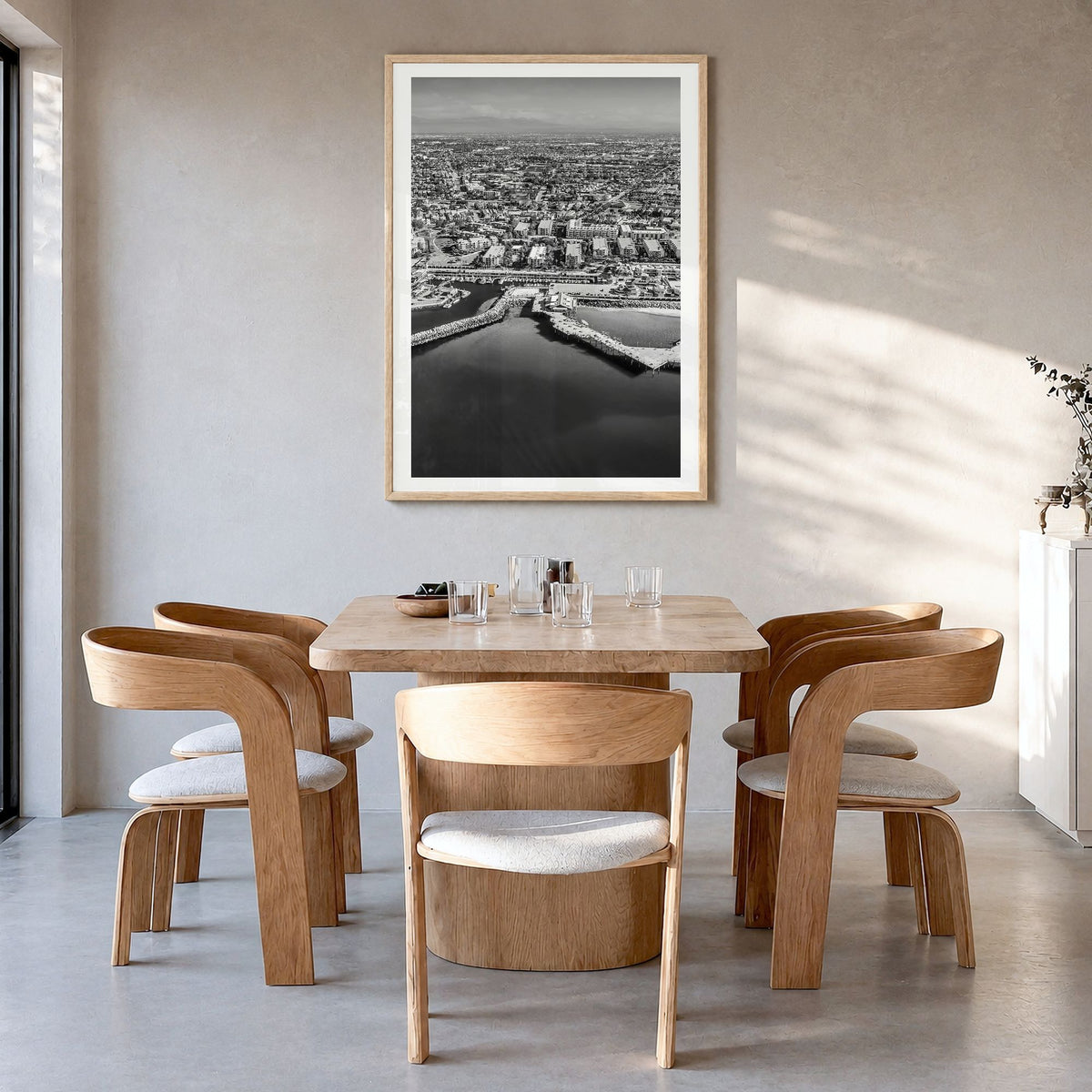 Redondo Beach Photo Poster in a natural wood frame, hanging in a dining room, white border