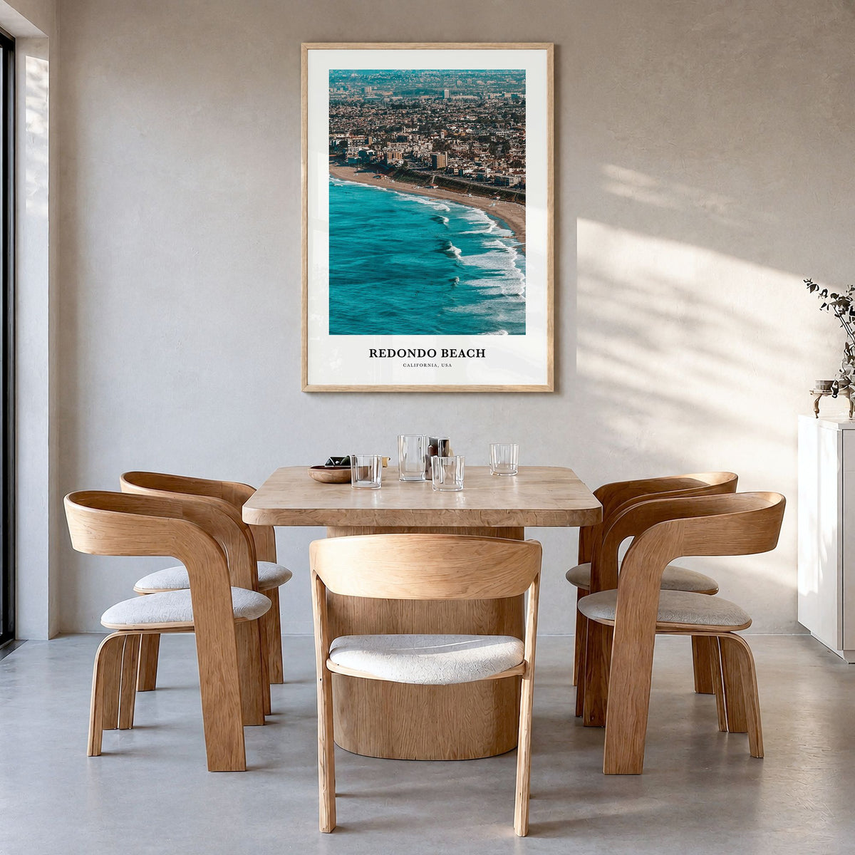 Redondo Beach Classic Poster in a natural wood frame, hanging in a dining room