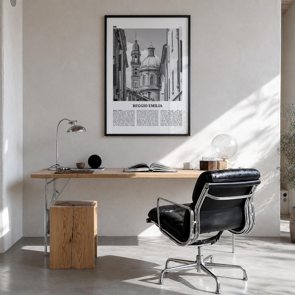 Reggio Emilia black & white newspaper poster of Italy – vertical wall art in black wood frame, hanging on wall