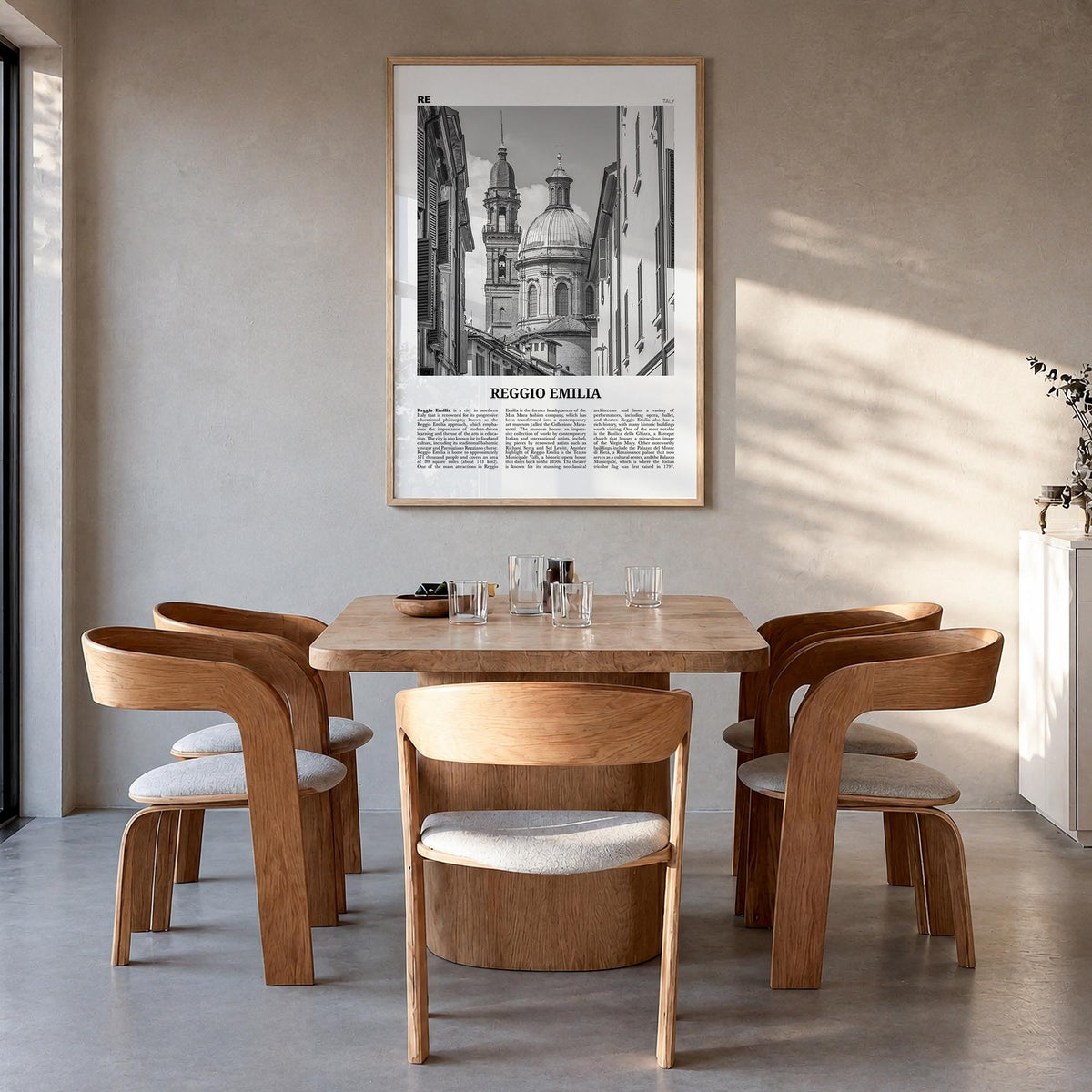Reggio Emilia black & white newspaper poster of Italy – vertical wall art in natural wood frame, hanging on wall