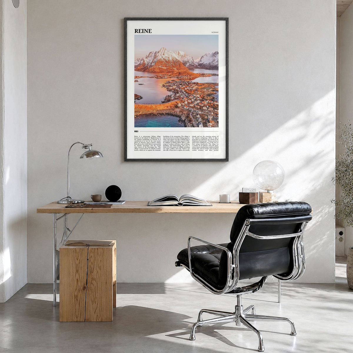 Reine Travel Poster in a black wood frame, hanging in a bright home office