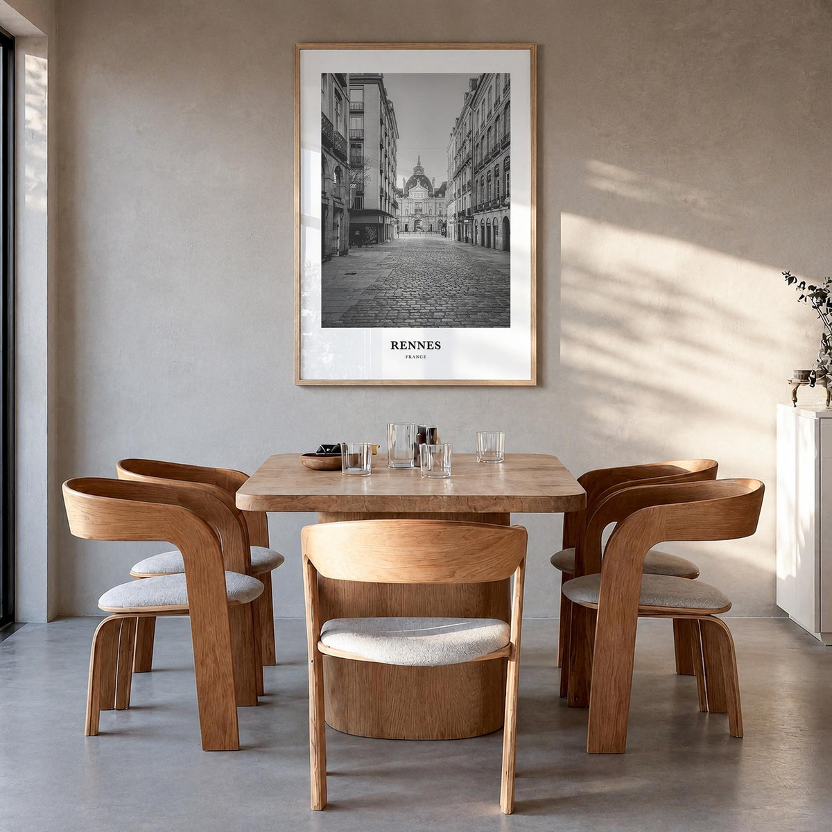Rennes black & white classic poster of France – vertical wall art in natural wood frame, hanging on wall