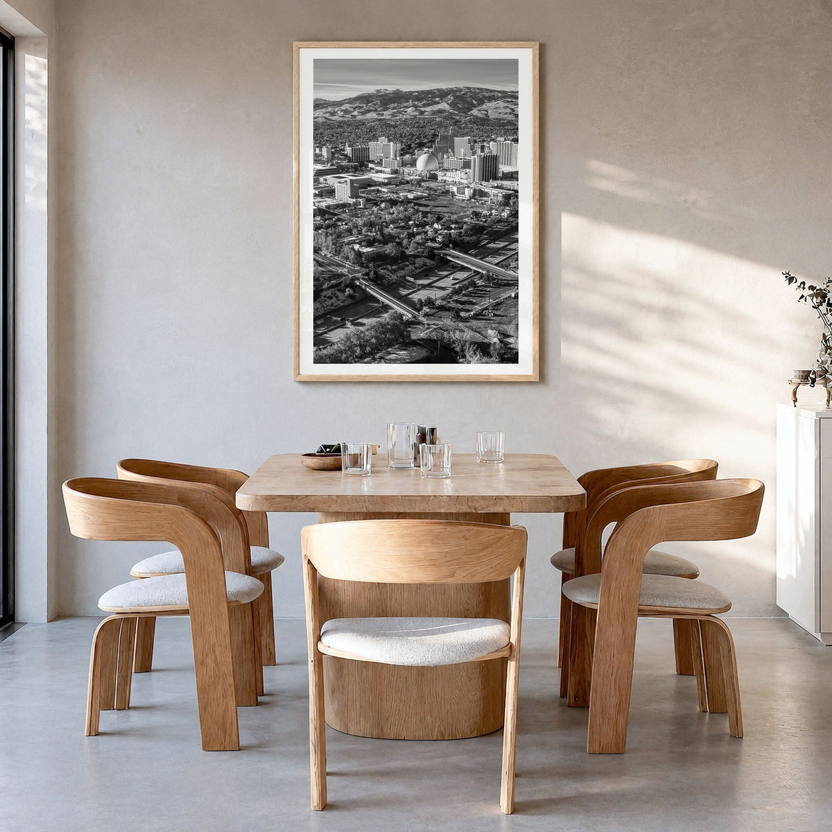 Reno Photo Poster in a natural wood frame, hanging in a dining room, white border