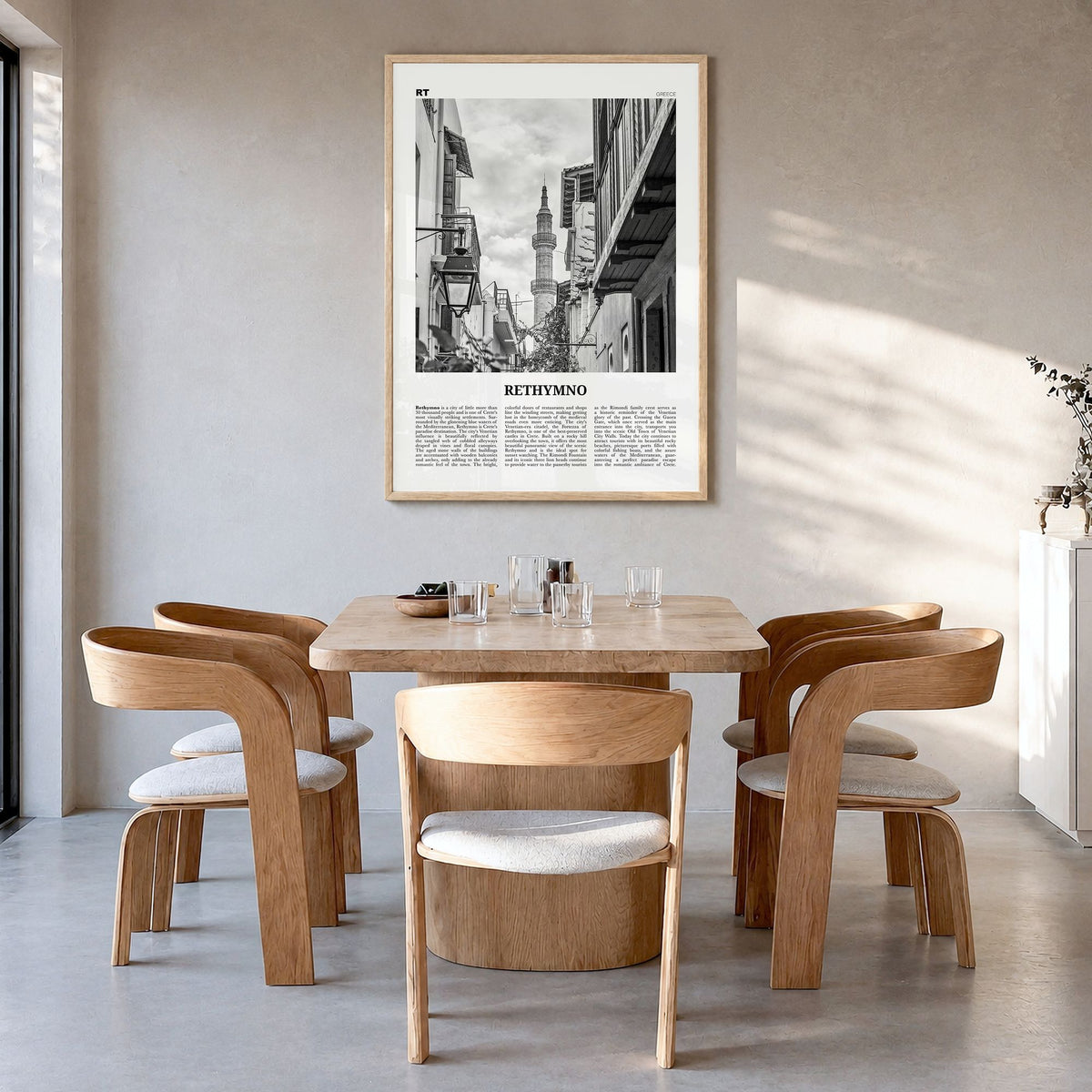 Rethymno Newspaper Poster in a natural wood frame, hanging in a dining room