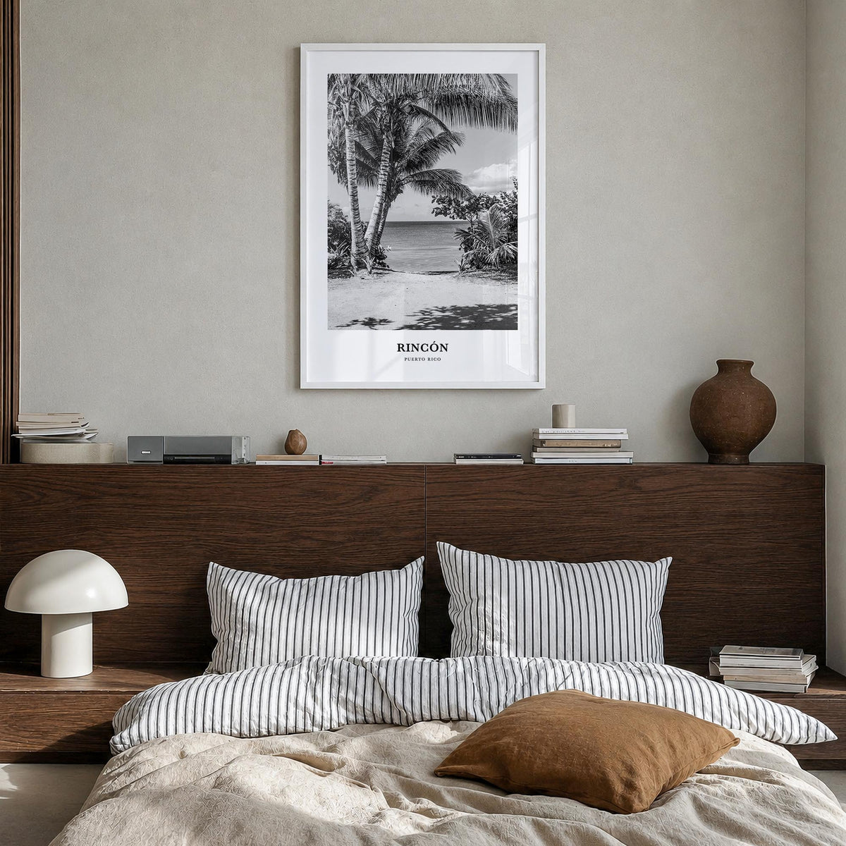 Rincón black & white classic poster of Puerto Rico – vertical wall art in white wood frame, hanging on wall