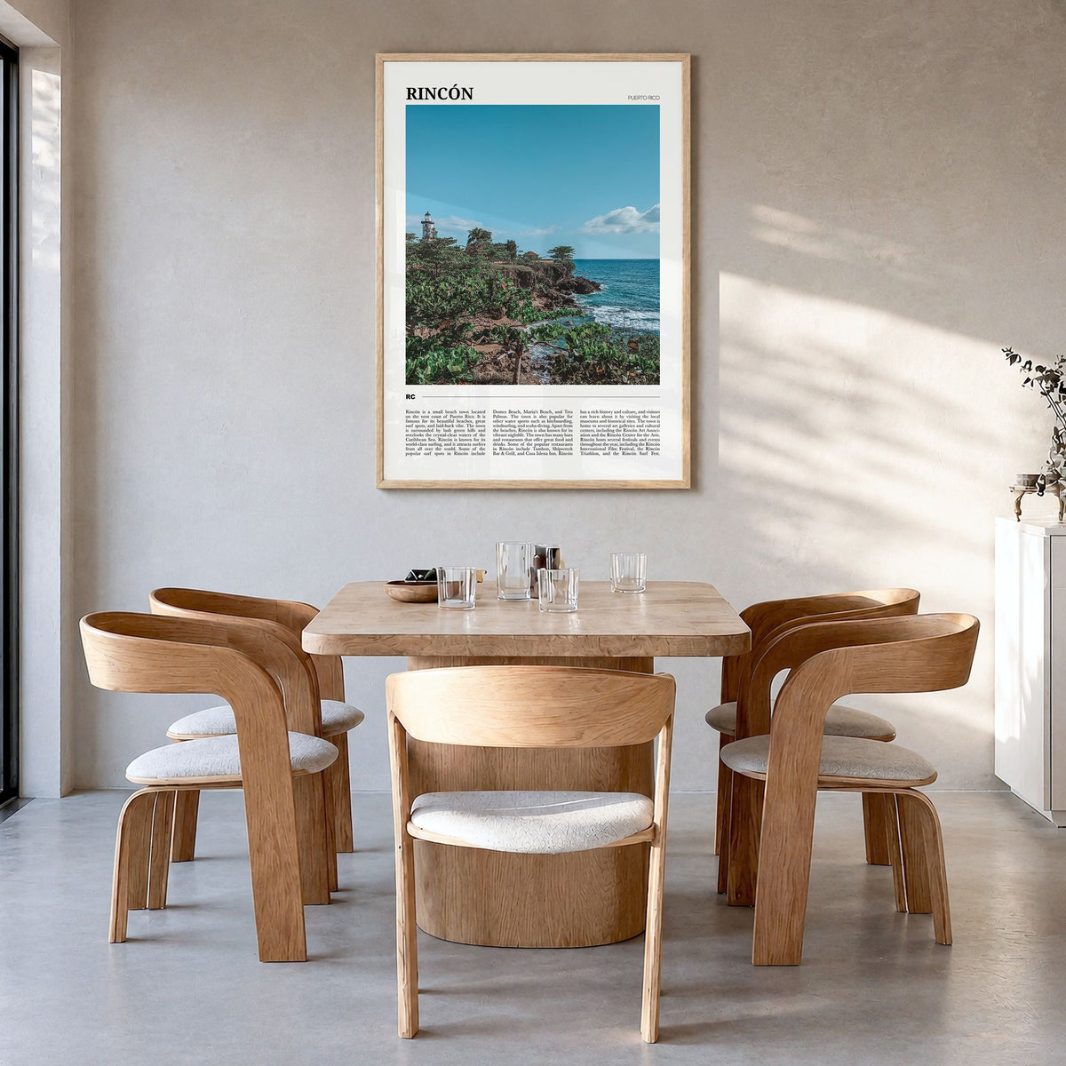 Rincón Travel Poster in a natural wood frame, hanging in a dining room