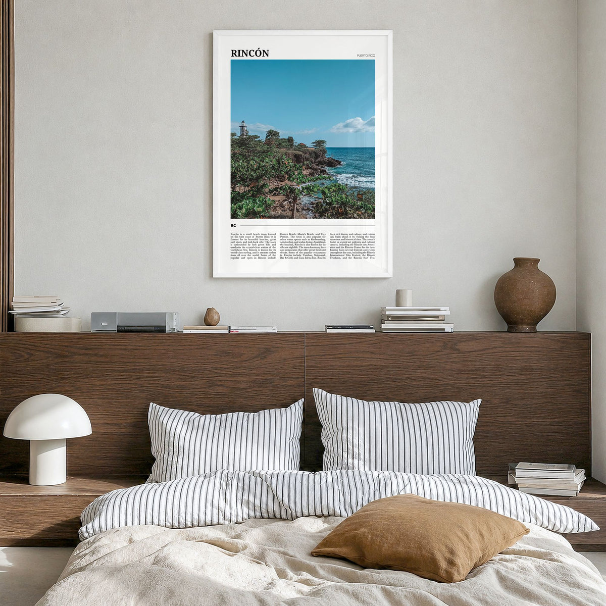 Rincón Travel Poster in a white wood frame, hanging in a bedroom