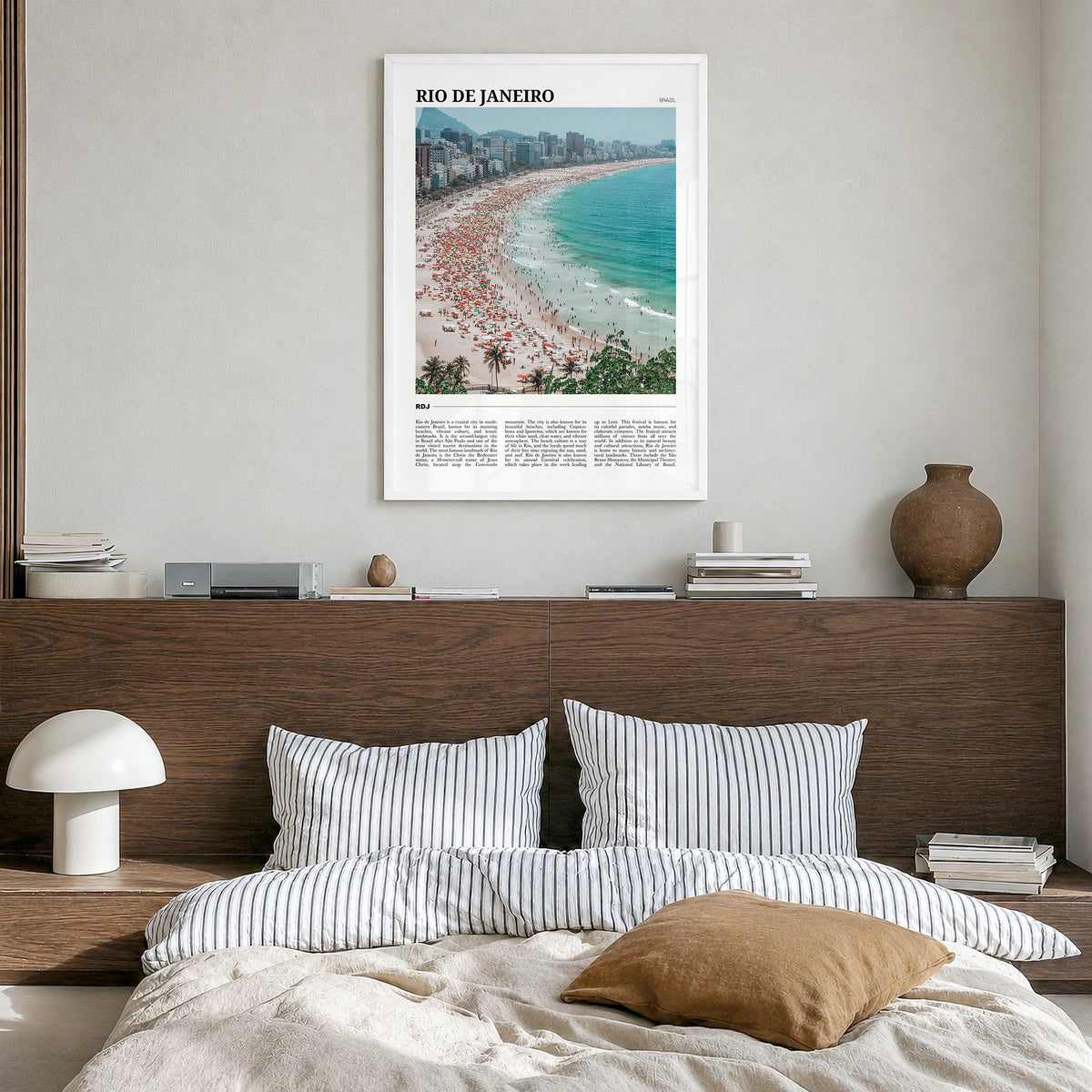 Rio de Janeiro Travel Poster in a white wood frame, hanging in a bedroom