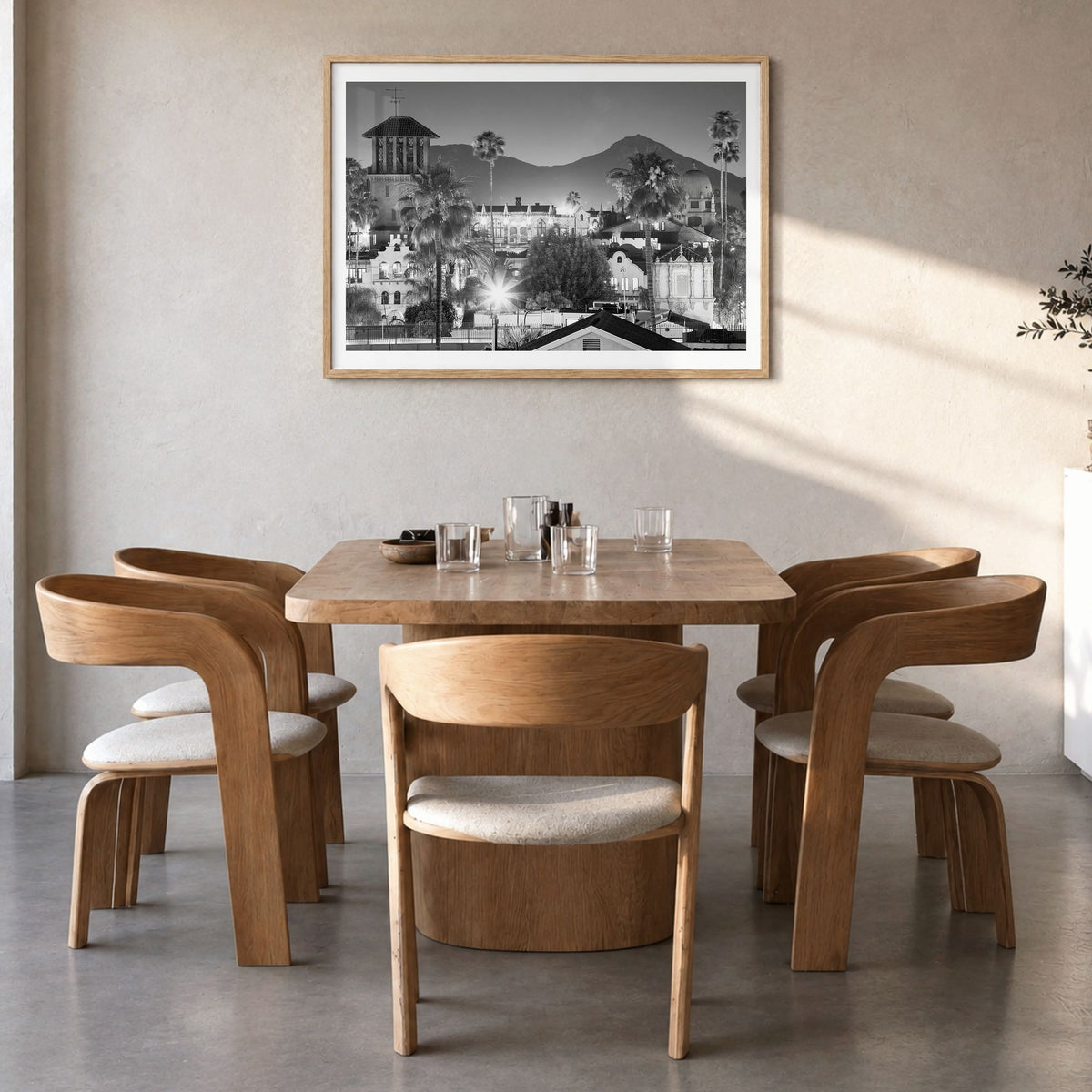 Riverside Photo Poster in a natural wood frame, hanging in a dining room, white border