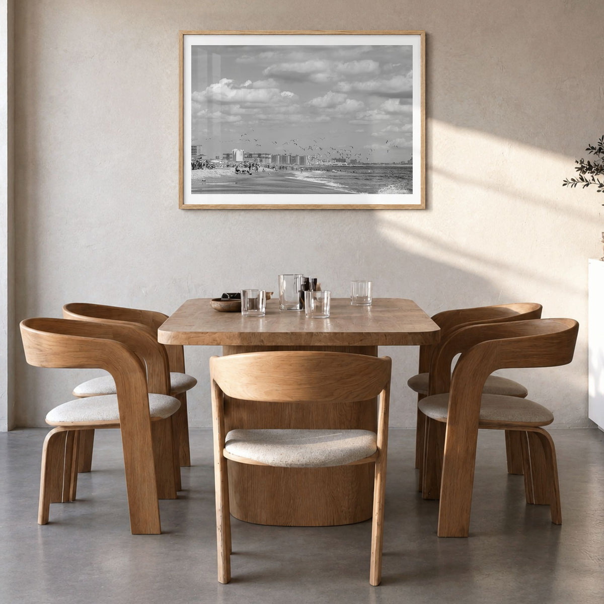 Rockaway Beach Photo Poster in a natural wood frame, hanging in a dining room, white border