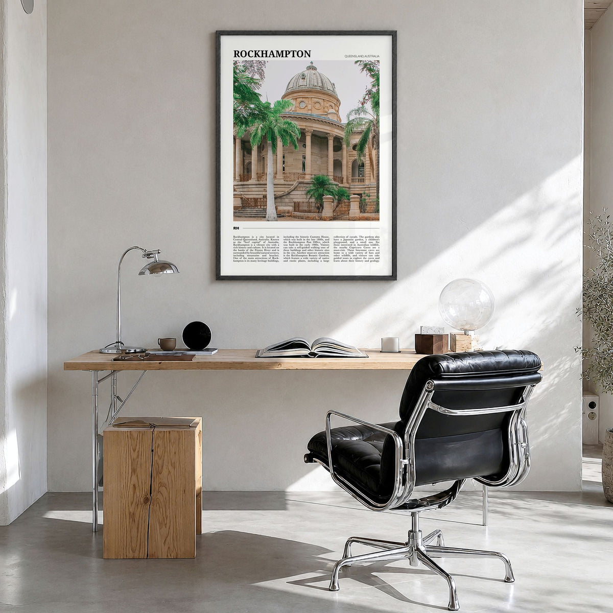 Rockhampton Travel Poster in a black wood frame, hanging in a bright home office