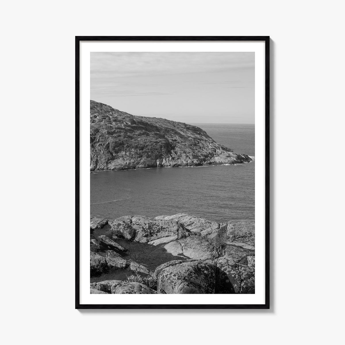 Rocky Coast no. 1 black & white photo poster – vertical wall art, unframed print shown in interior mockup