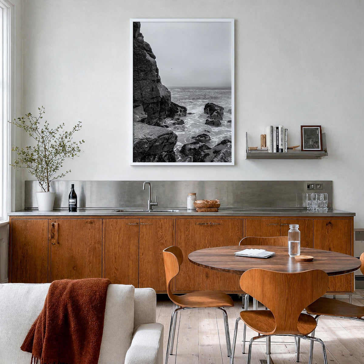 Rocky Coast no. 2 black & white photo poster – vertical wall art in white wood frame, hanging on wall