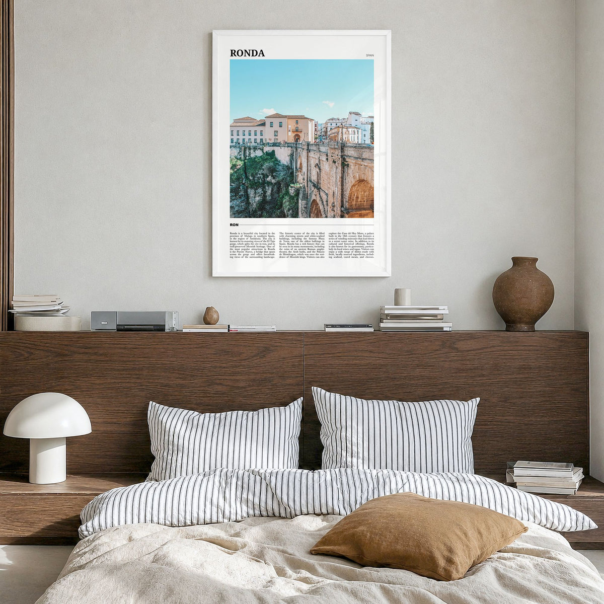 Ronda Travel Poster in a white wood frame, hanging in a bedroom