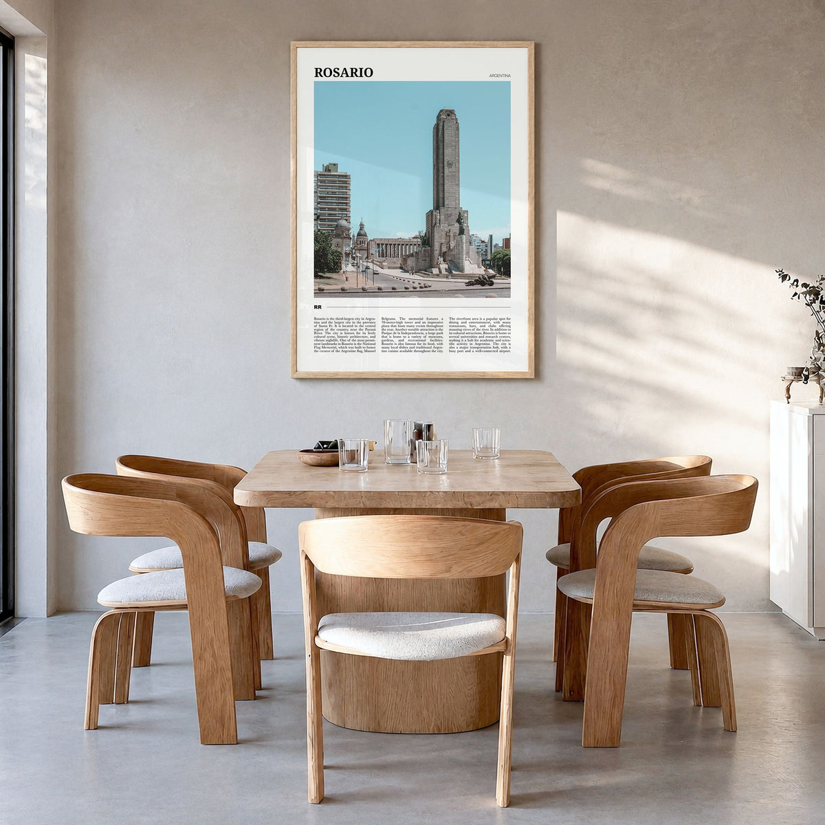 Rosario Travel Poster in a natural wood frame, hanging in a dining room