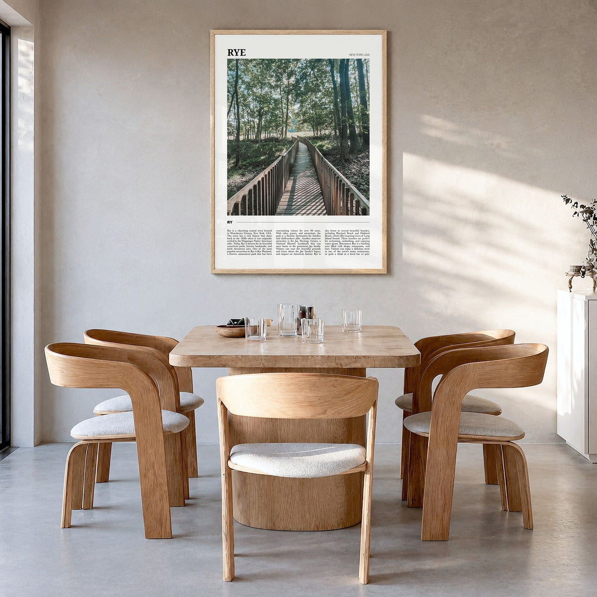 Rye Travel Poster in a natural wood frame, hanging in a dining room