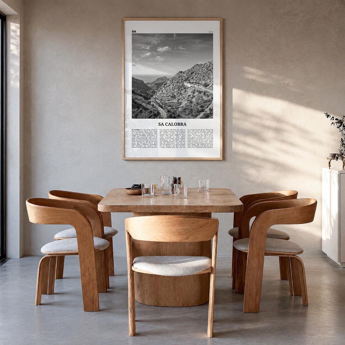 Sa Calobra black & white newspaper poster of Spain – vertical wall art in natural wood frame, hanging on wall
