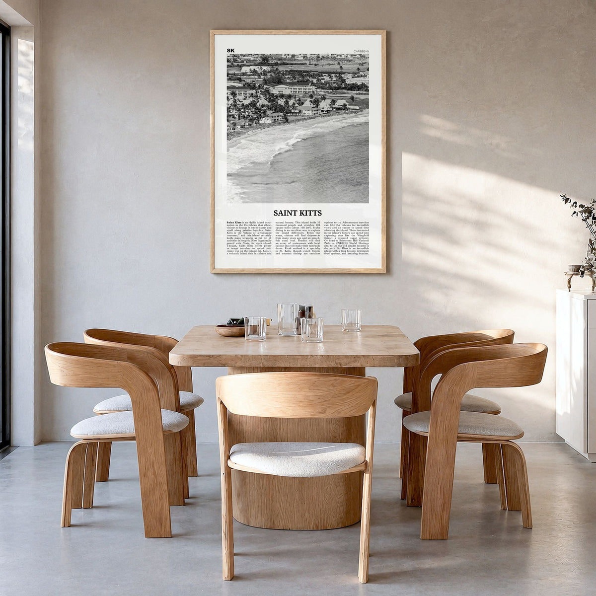 Saint Kitts Newspaper Poster in a natural wood frame, hanging in a dining room