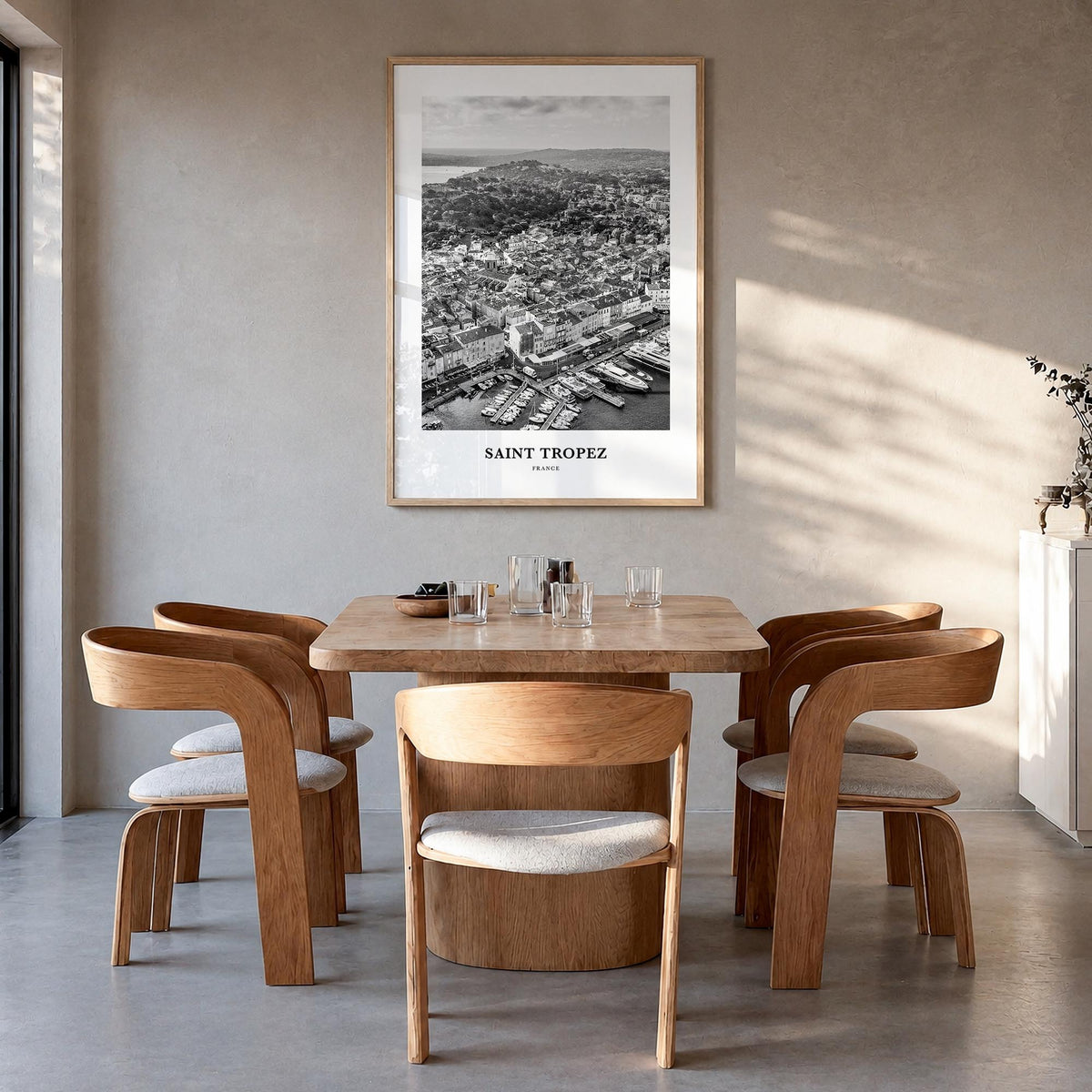 Saint-Tropez black & white classic poster of France – vertical wall art in natural wood frame, hanging on wall