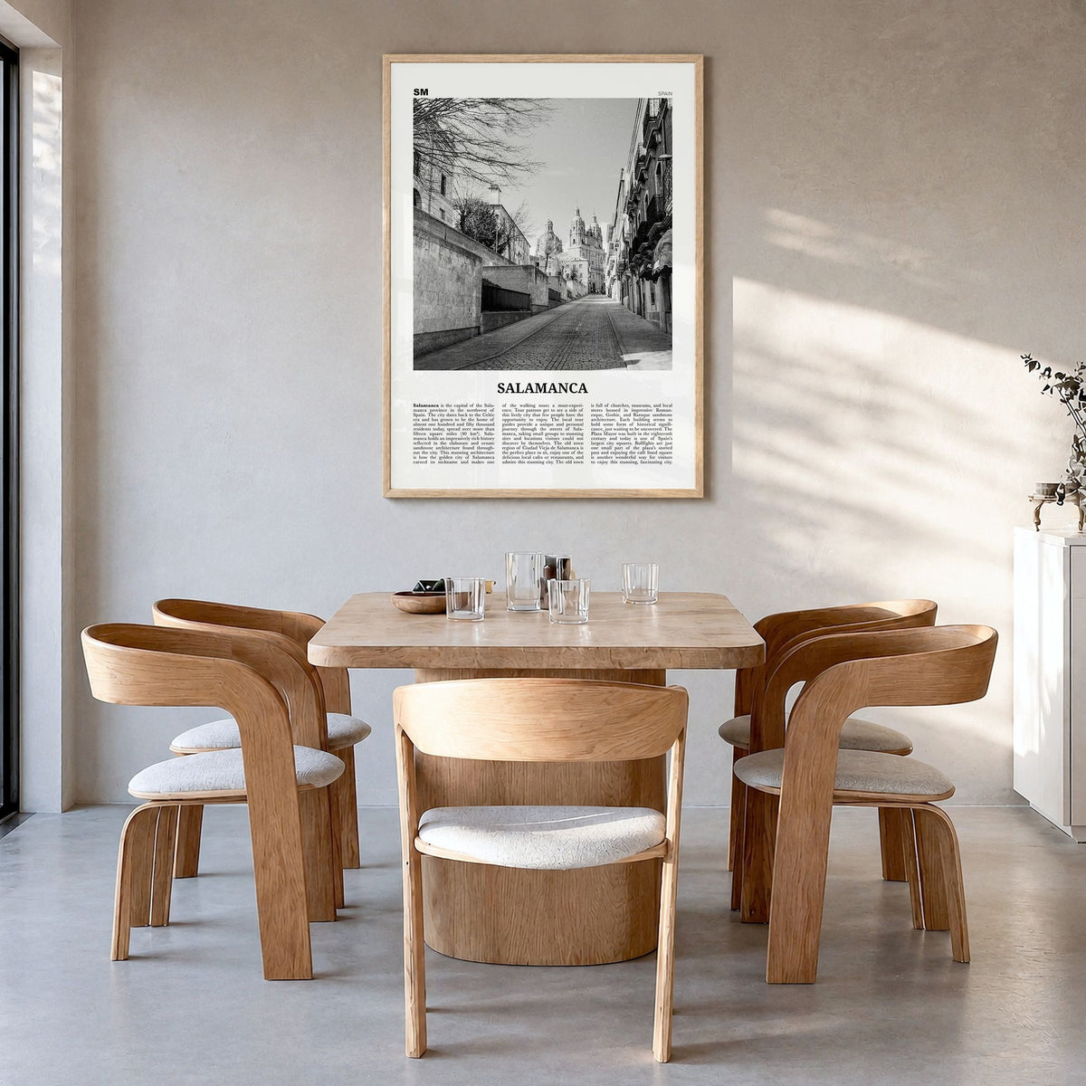 Salamanca Newspaper Poster in a natural wood frame, hanging in a dining room
