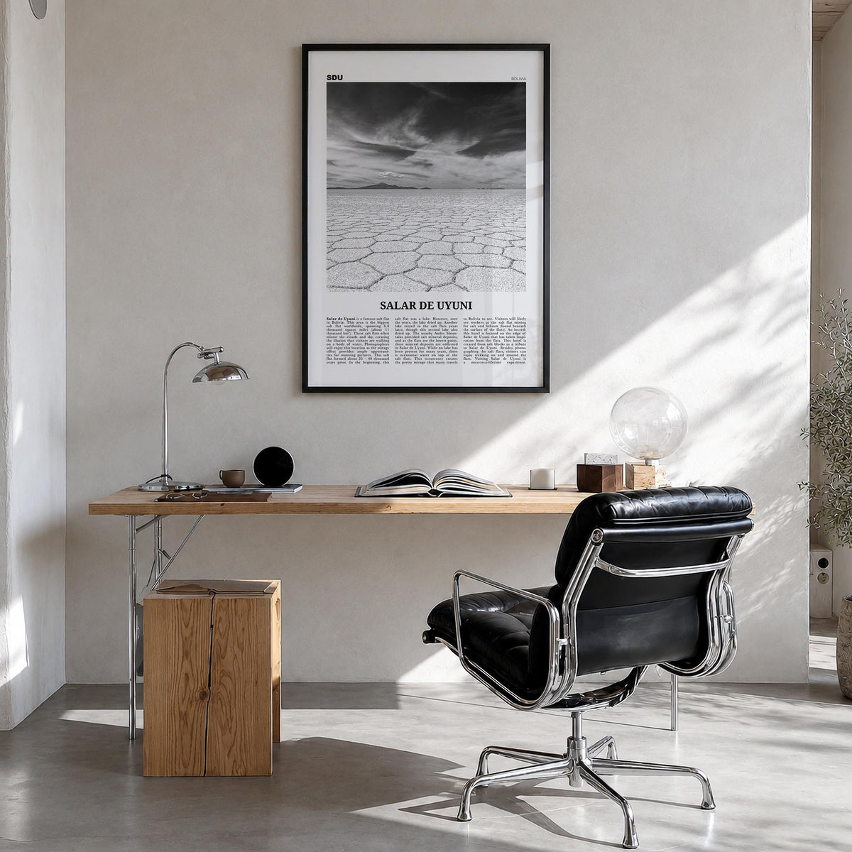 Salar de Uyuni black & white newspaper poster of Bolivia – vertical wall art in black wood frame, hanging on wall