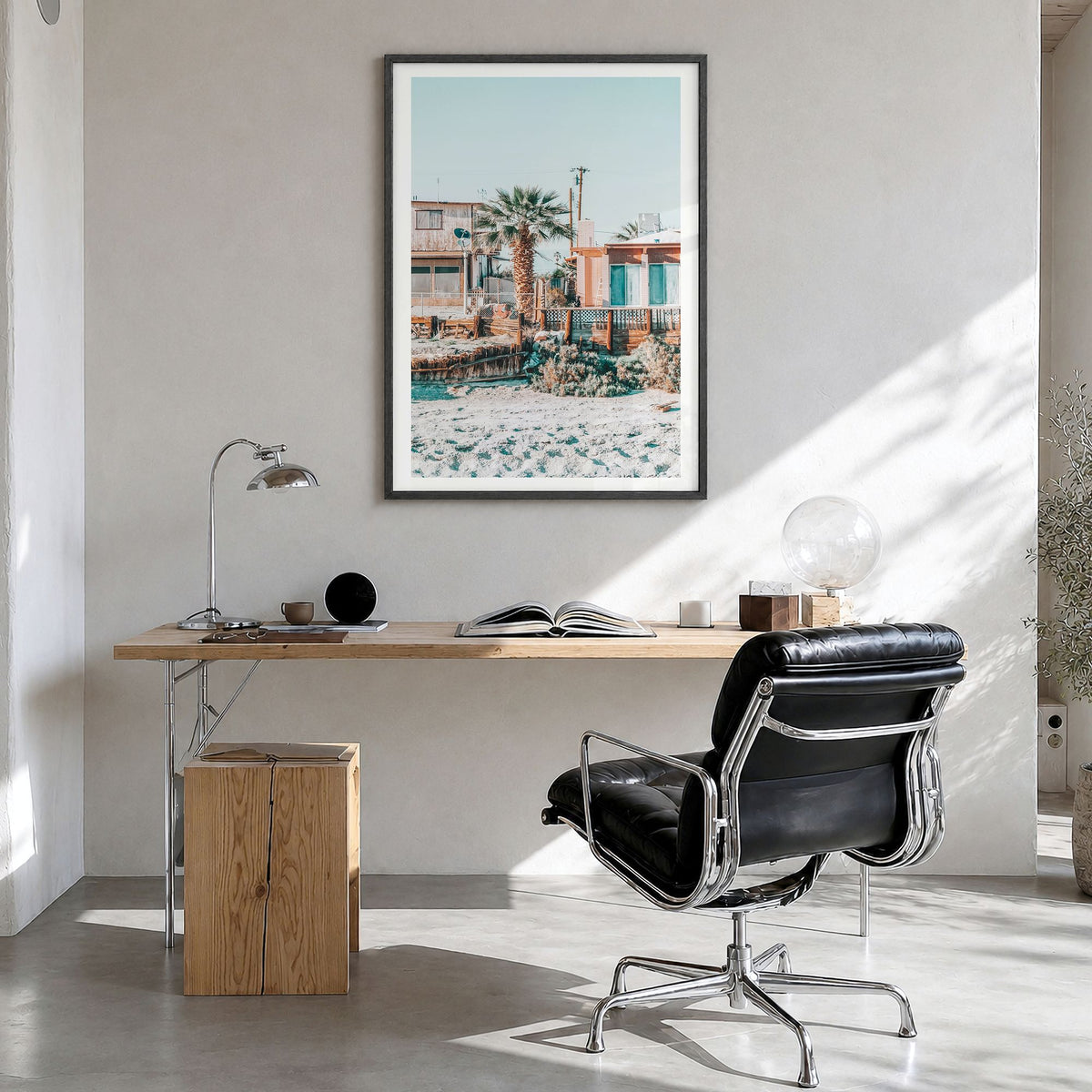Salton Sea Beach Photo Poster in a black wood frame, hanging in a bright home office, white border