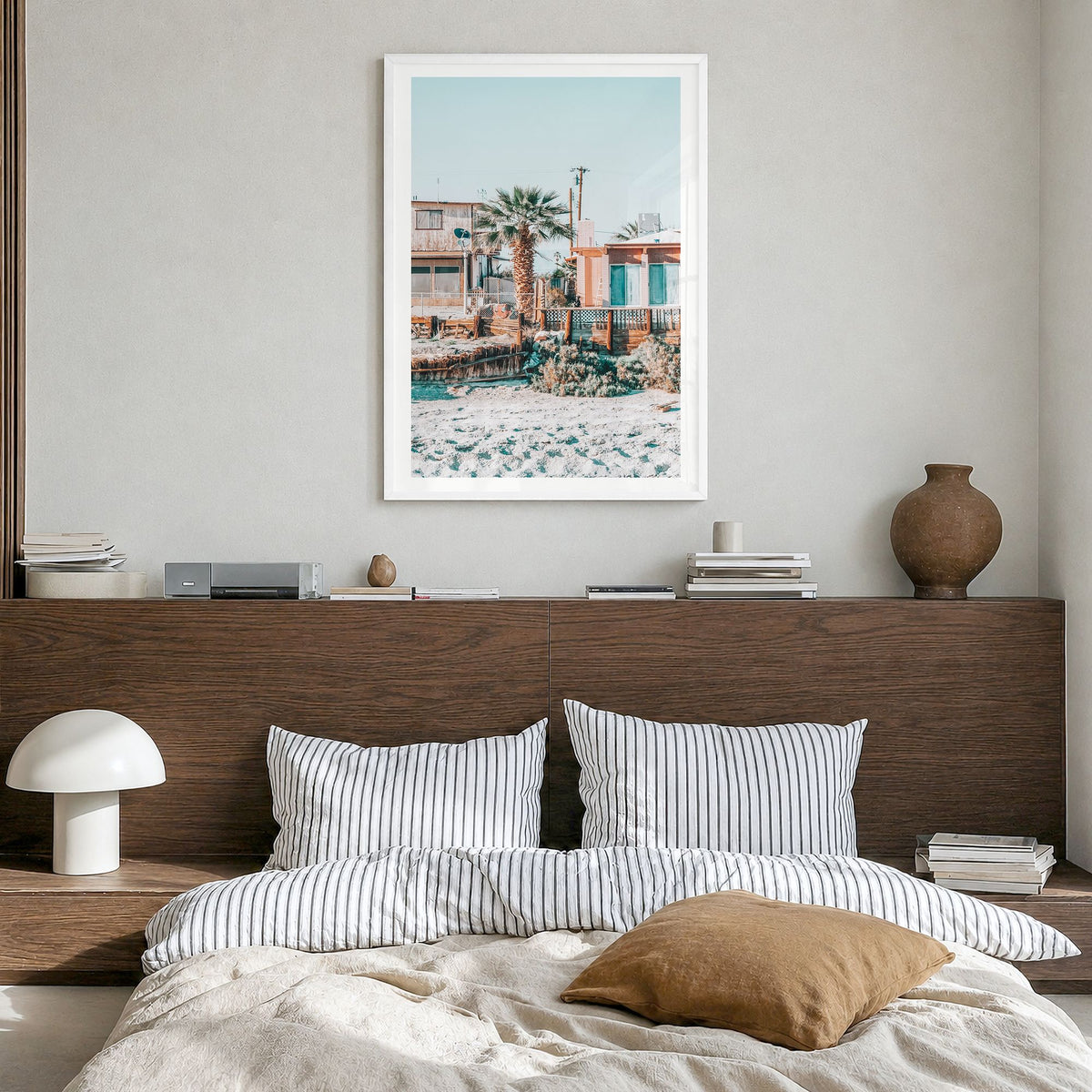 Salton Sea Beach Photo Poster in a white wood frame, hanging in a bedroom, white border