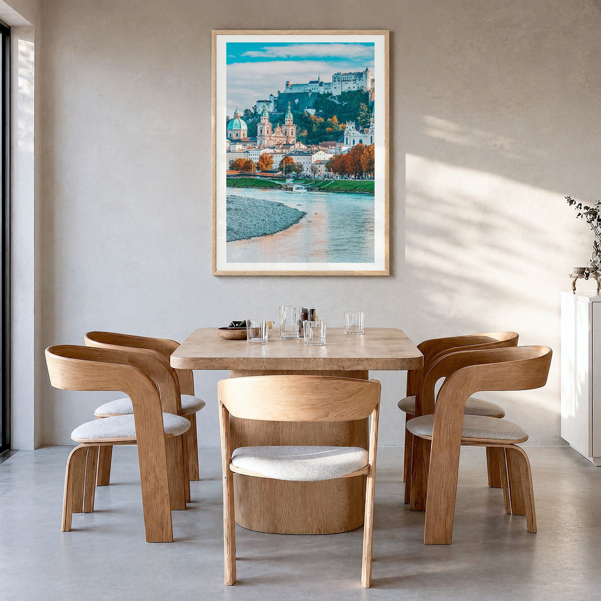 Salzburg Photo No 1 Poster in a natural wood frame, hanging in a dining room, white border
