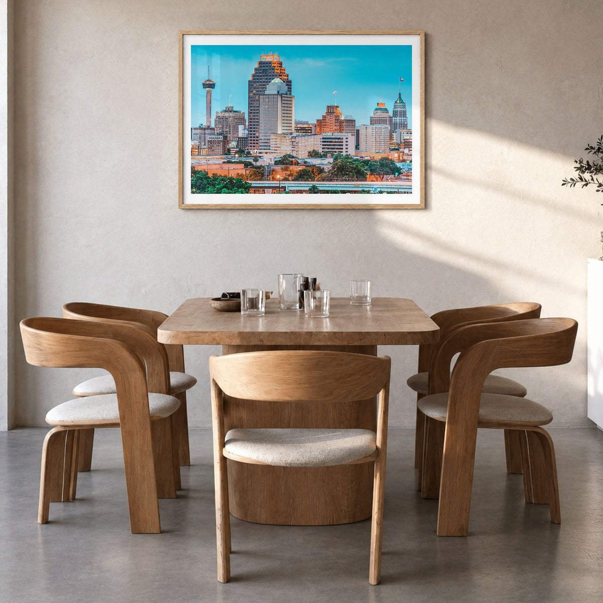 San Antonio Photo Poster in a natural wood frame, hanging in a dining room, white border