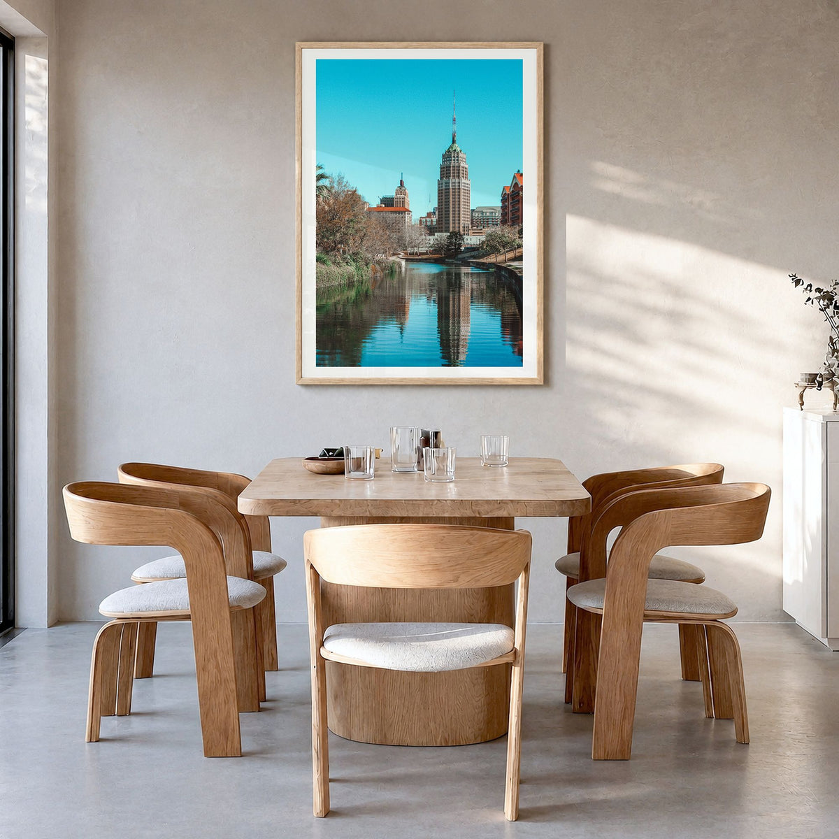 San Antonio Photo No 2 Poster in a natural wood frame, hanging in a dining room, white border