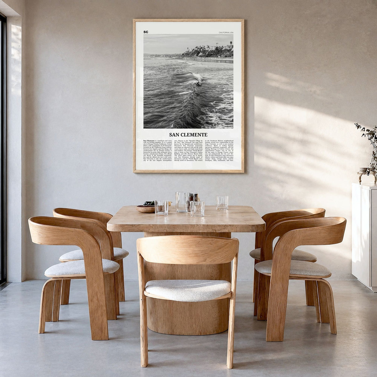 San Clemente Newspaper No 2 Poster in a natural wood frame, hanging in a dining room