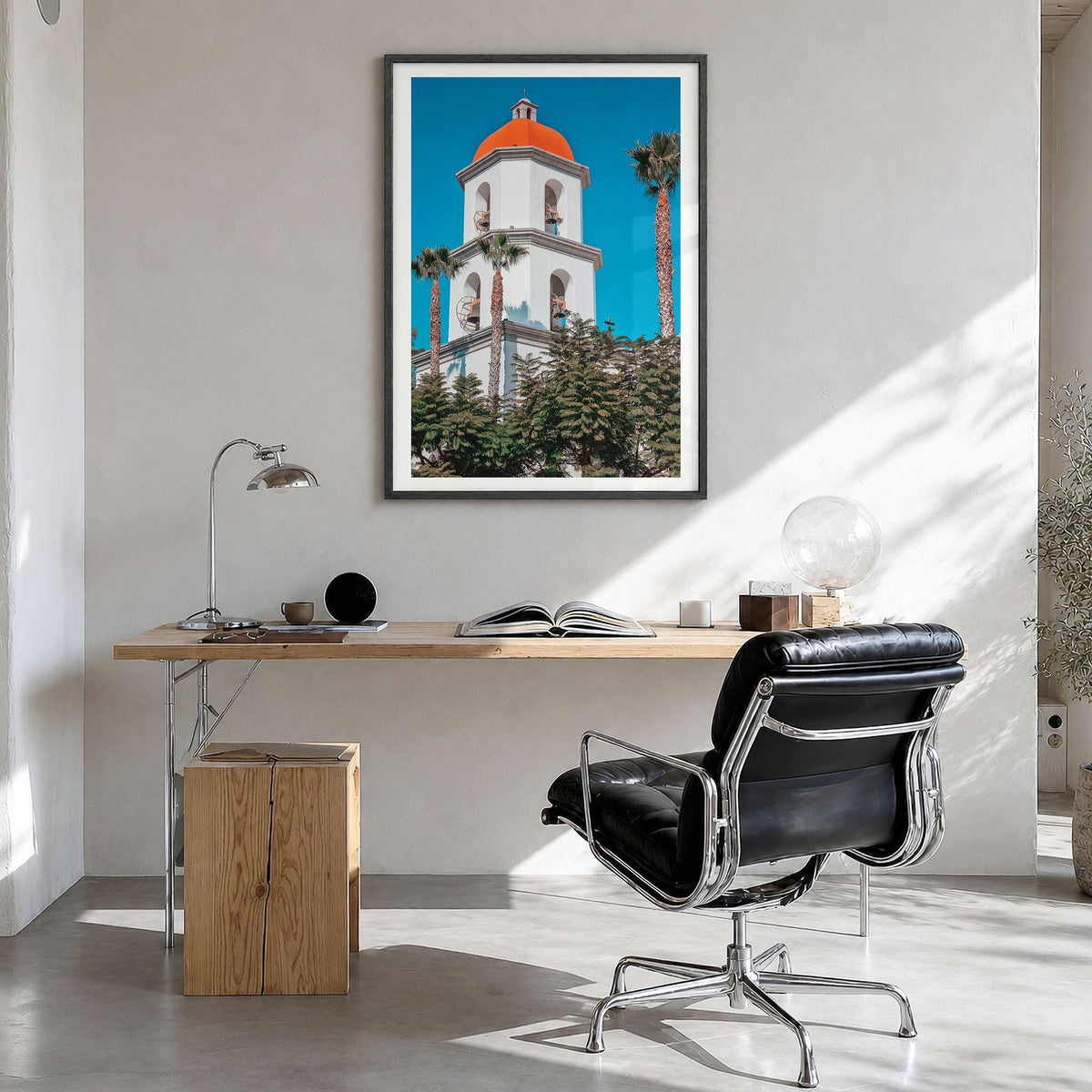 San Juan Capistrano Photo Poster in a black wood frame, hanging in a bright home office, white border