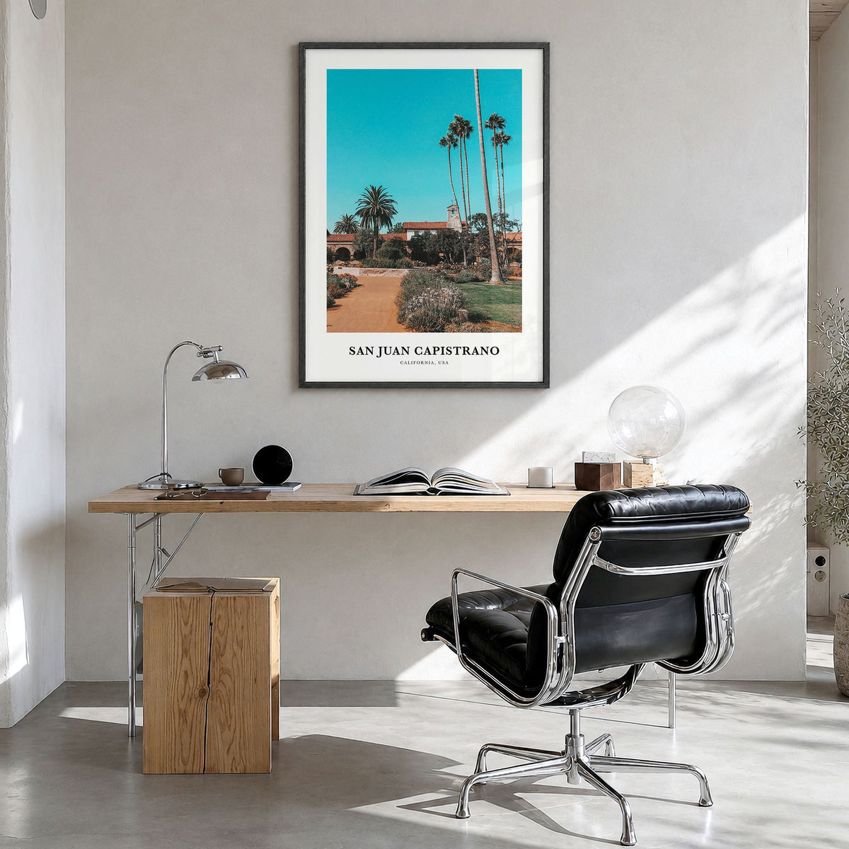 San Juan Capistrano Classic Poster in a black wood frame, hanging in a bright home office