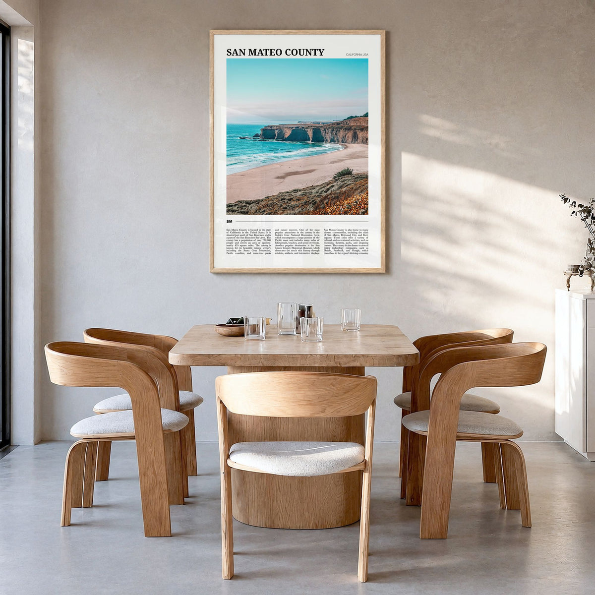 San Mateo County Travel Poster in a natural wood frame, hanging in a dining room